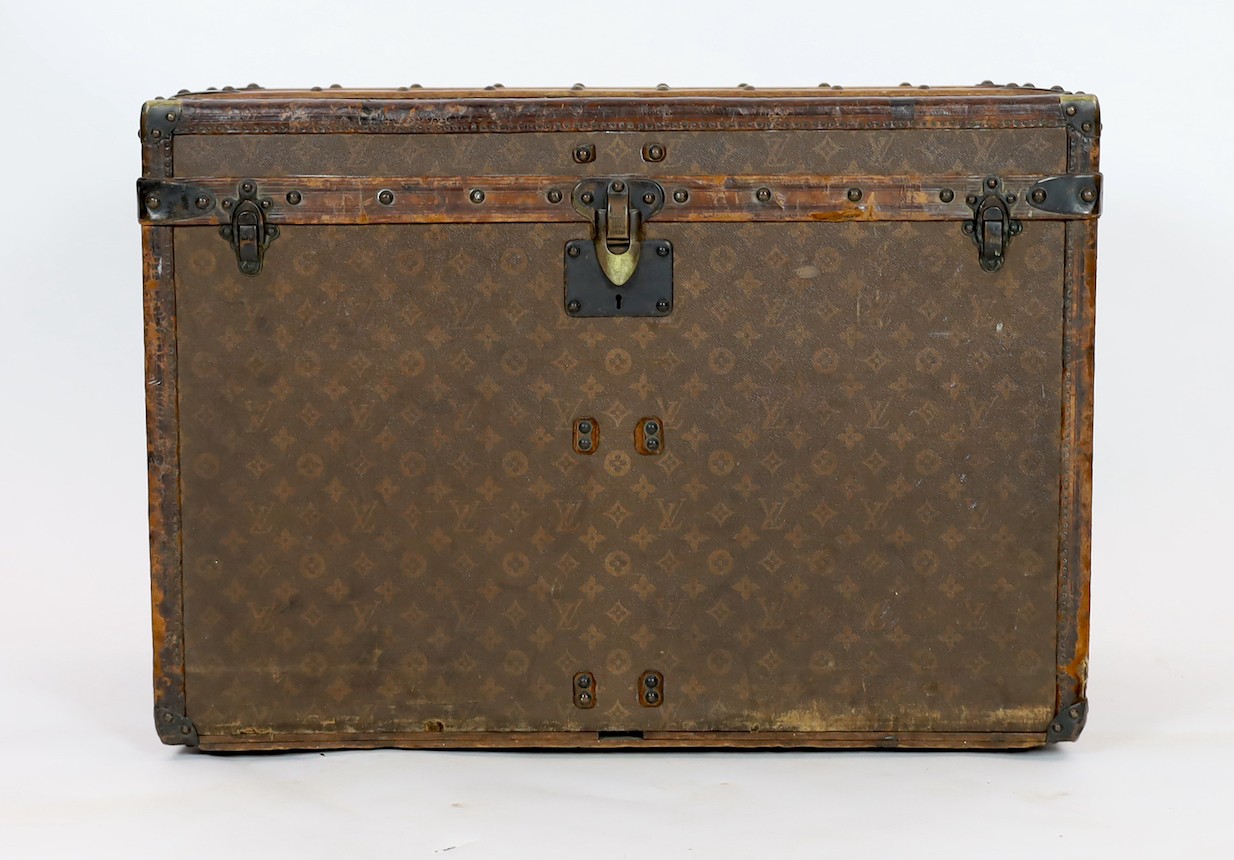 A Louis Vuitton brass mounted leather bound trunk, c.1910, numbered 137426, 75cm wide, 43cm deep, 54cm high